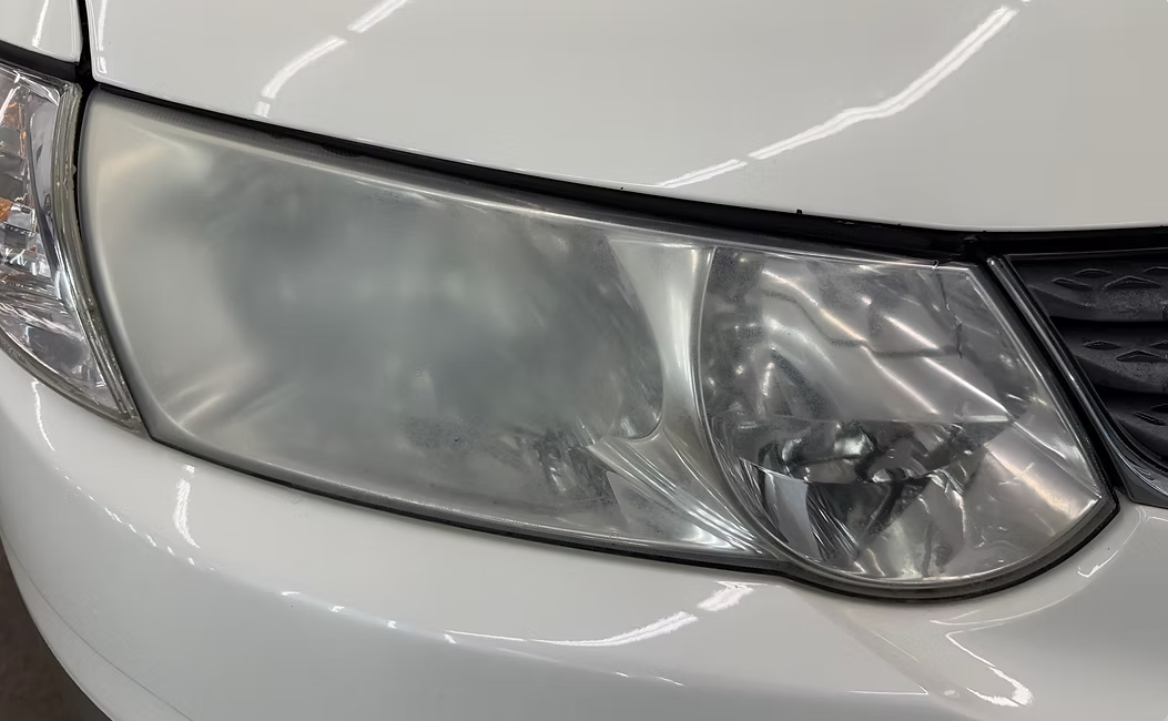 Headlight before restoration — hazy and oxidized